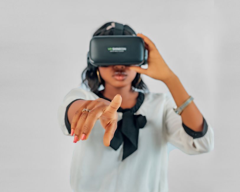 Young woman using VR headset for immersive virtual reality experience.
